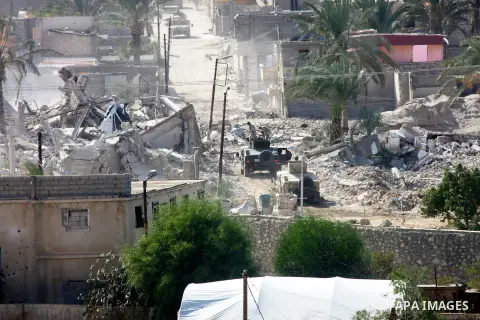 Egyptian security forces take part in a military operation to demolish some buildings in the Egyptian city of Rafah near the border with southern Gaza Strip October 29, 2014, as Egypt began setting up a buffer zone along...