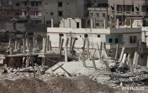 Egyptians inspect a house after it was demolished by Egyptian security forces during a military operation in the Egyptian city of Rafah near the border with southern Gaza Strip October 30, 2014, as Egypt began setting up...