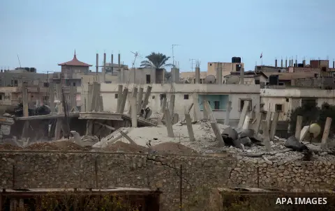 Smoke rises after a house was blown up during a military operation by Egyptian security forces in the Egyptian city of Rafah near the border with southern Gaza Strip October 30, 2014, as Egypt began setting up a buffer z...