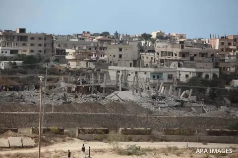 Egyptians inspect a house after it was demolished by Egyptian security forces during a military operation in the Egyptian city of Rafah near the border with southern Gaza Strip October 30, 2014, as Egypt began setting up...