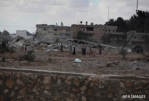 Egyptians inspect a house after it was demolished by Egyptian security forces during a military operation in the Egyptian city of Rafah near the border with southern Gaza Strip October 30, 2014, as Egypt began setting up...