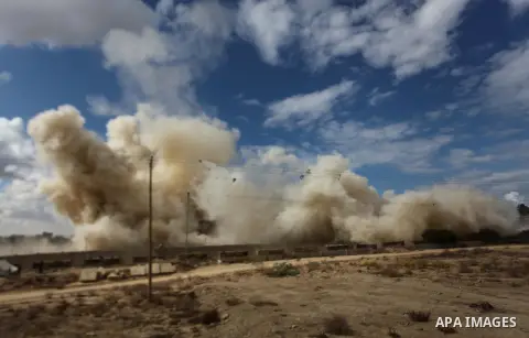 Smoke rises after a house was blown up during a military operation by Egyptian security forces in the Egyptian city of Rafah near the border with southern Gaza Strip October 30, 2014, as Egypt began setting up a buffer z...