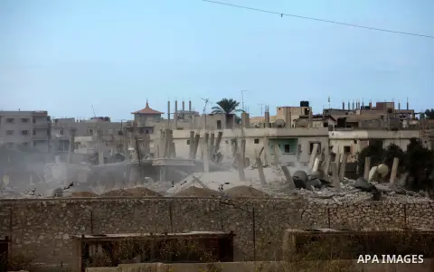 Smoke rises after a house was blown up during a military operation by Egyptian security forces in the Egyptian city of Rafah near the border with southern Gaza Strip October 30, 2014, as Egypt began setting up a buffer z...