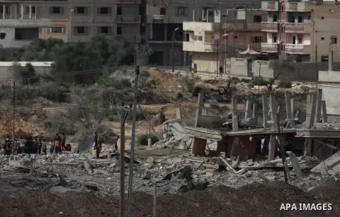 Egyptians inspect a house after it was demolished by Egyptian security forces during a military operation in the Egyptian city of Rafah near the border with southern Gaza Strip October 30, 2014, as Egypt began setting up...