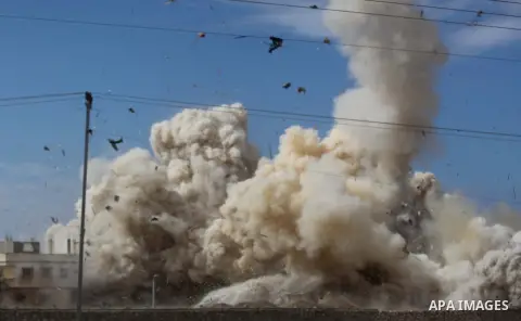 Smoke rises after a house was blown up during a military operation by Egyptian security forces in the Egyptian city of Rafah near the border with southern Gaza Strip October 30, 2014, as Egypt began setting up a buffer z...