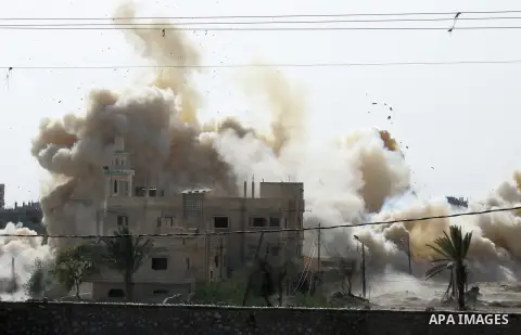Smoke rises after a house was blown up during a military operation by Egyptian security forces in the Egyptian city of Rafah near the border with southern Gaza Strip Nov. 01, 2014, as Egypt began setting up a buffer zone...