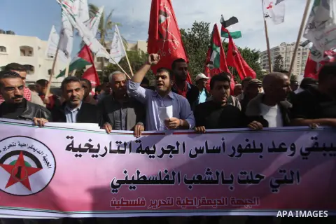 Palestinian supporters of the Democratic Front for the Liberation of Palestine hold banners during a demonstration in Gaza City to mark the anniversary of the Balfour Declaration on Nov. 02, 2014. The 1917 Balfour Declar...