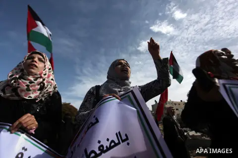 Palestinian supporters of the Democratic Front for the Liberation of Palestine hold banners during a demonstration in Gaza City to mark the anniversary of the Balfour Declaration on Nov. 02, 2014. The 1917 Balfour Declar...