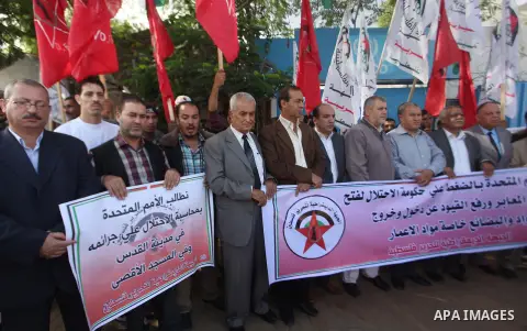 Palestinian supporters of the Democratic Front for the Liberation of Palestine hold banners during a demonstration in Gaza City to mark the anniversary of the Balfour Declaration on Nov. 02, 2014. The 1917 Balfour Declar...