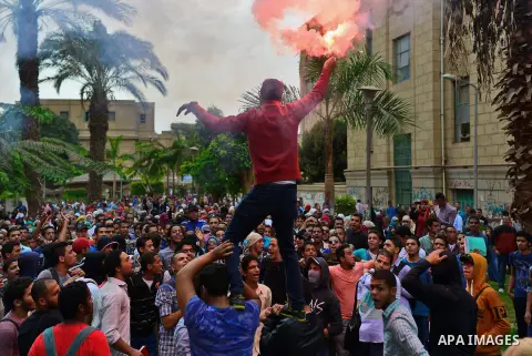Egyptian students who support Muslim Brotherhood and ousted president Mohammed Morsi, shot slogans during a demonstration against military rule, in Cairo, Egypt, on Nov. 02, 2014. Photo by Amr Sayed