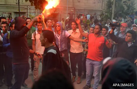 Egyptian students who support Muslim Brotherhood and ousted president Mohammed Morsi, shot slogans during a demonstration against military rule, in Cairo, Egypt, on Nov. 02, 2014. Photo by Amr Sayed