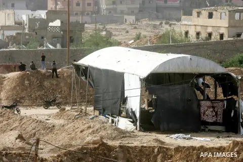 Palestinians in Gaza look at a house destroyed by Egyptian security forces as they conducted an operation in the Egyptian city of Rafah near the border with southern Gaza Strip on November 2, 2014, as Egypt began setting...