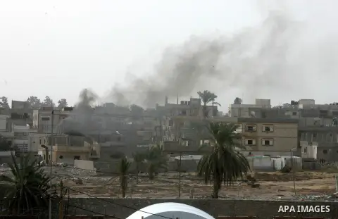 Smoke rises after a house was blown up during a military operation by Egyptian security forces in the Egyptian city of Rafah near the border with southern Gaza Strip on November 2, 2014, as Egypt began setting up a buffe...