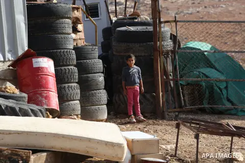 A Palestinian boy stans near the remains of his family house, after it was demolished by Israeli authorities who said it was built without municipal permission in Khirbet Al-Taweel village near the West Bank City of Nabl...
