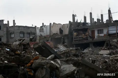 Palestinians inspect the ruins of a house that witnesses said was destroyed by Israeli shelling during the most recent conflict between Israel and Hamas, on a rainy day in the east of Gaza City November 3, 2014. Photo by...