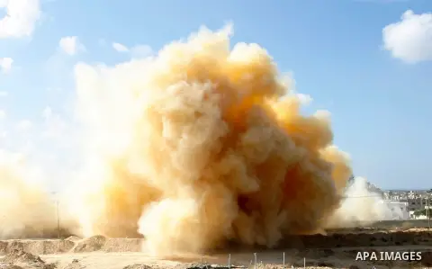 Smoke rises after a house is blown up during a military operation by Egyptian security forces in the Egyptian city of Rafah, near the border with southern Gaza Strip November 3, 2014. Egypt began clearing residents from...