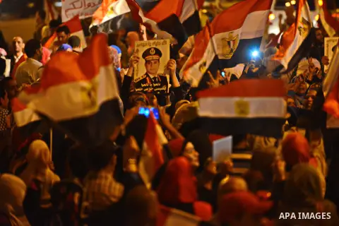 Egyptian demonstrators display posters of President Abdel Fattah al-Sisi during a rally in Cairo in support of Sisi's decree aimed at "protecting public installations and utilities from terrorist attacks", on November 04...