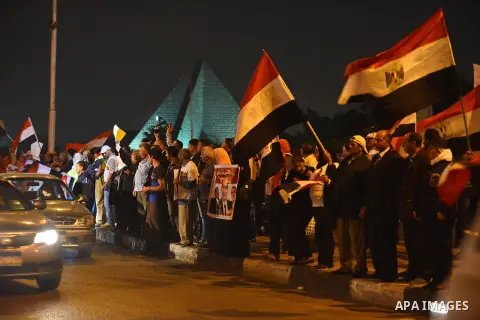 Egyptian demonstrators display posters of President Abdel Fattah al-Sisi during a rally in Cairo in support of Sisi's decree aimed at "protecting public installations and utilities from terrorist attacks", on November 04...