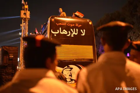 Egyptian demonstrators hold banners during a rally in Cairo in support of Sisi's decree aimed at "protecting public installations and utilities from terrorist attacks", on November 04, 2014. Sisi enacted a decree allowin...