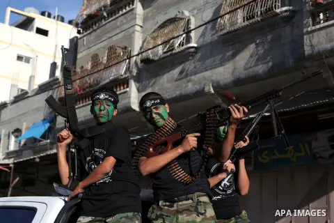 Young Palestinians from Hamas's "popular army" take part in a military graduation ceremony in Jabaliya refugee camp in the northern Gaza Strip November 7, 2014. Hamas recently formed a "popular army" for young Palestinia...