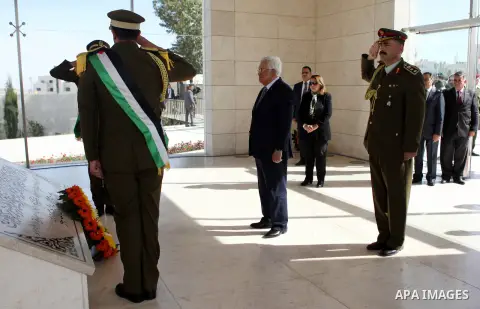 Palestinian president Mahmud Abbas prays on the grave of late Palestinian leader Yasser Arafat during a ceremony to mark the tenth anniversary of Arafat's death in the West Bank city of Ramallah on November 11, 2014. Ara...