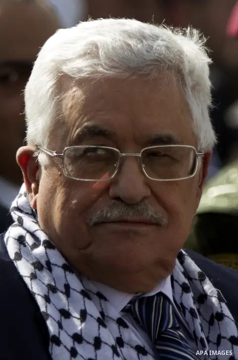 Palestinian president Mahmud Abbas looks on during a ceremony to mark the tenth anniversary of the death of late Palestinian leader Yasser Arafat in the West Bank city of Ramallah on November 11, 2014. Arafat died in a m...