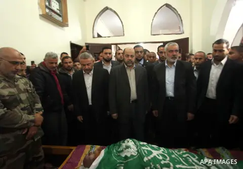 Senior leader of Hamas Ismail Haniyeh takes part a funeral of a co-founder of the Hamas movement Mohammad Salih Taha in al-Bureij refugee camp in the central of Gaza strip, on Nov. 12, 2014. Taha, often called Abu Ayman,...