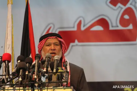Palestinian head of the Parliamentary Committee of the Legislative Council, Marwan Abou Rass speaks during a press conference about the Jerusalem, in Gaza City, on Nov. 13, 2014. Photo by Mohammed Asad