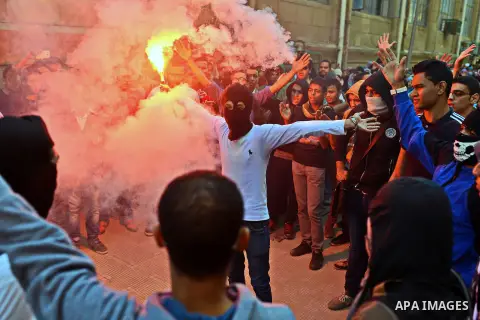 Egyptian students who support Muslim Brotherhood and ousted president Mohammed Morsi, take part in a demonstration to mark the World Student Day', in Cairo on November 17, 2014. The Students Against The Coup (SAC) moveme...