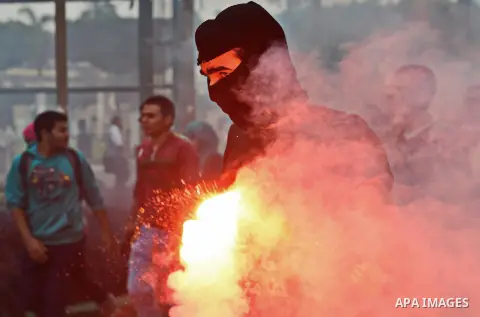 Egyptian students take part in a demonstration to commemorate the 3rd anniversary of deadly Mohamed Mahmoud clashes, at Cairo University on November 19, 2014. A number of political parties marched to commemorate the Nov....