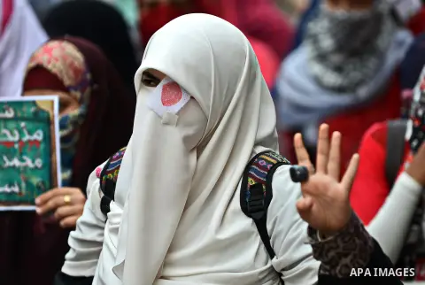 Egyptian students take part in a demonstration to commemorate the 3rd anniversary of deadly Mohamed Mahmoud clashes, at Cairo University on November 19, 2014. A number of political parties marched to commemorate the Nov....