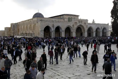 Palestinian worshippers walk at the Al-Aqsa mosque compound following Friday prayers in the Old City of Jerusalem on November 21, 2014. Israel eased age restrictions for Friday prayers at Jerusalem's flashpoint Al-Aqsa m...