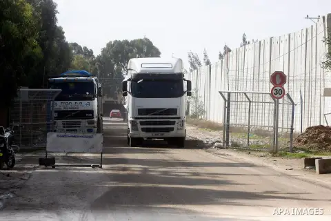 Trucks loaded with cement enter the Gaza Strip from Israel through the Kerem Shalom crossing in Rafah in the southern Gaza Strip on November 25, 2014. Twenty-eight trucks of cement entered the battered Gaza Strip Tuesday...
