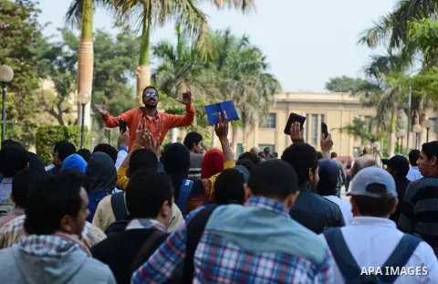 Egyptian students who support Muslim Brotherhood and ousted president Mohammed Morsi, take part in a demonstration against a military rule, in Cairo on November 25, 2014. Photo by Amr sayed