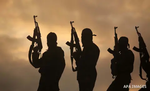 Members of Al-Quds Brigades, the military wing of Palestinian Islamic Jihad, partol during military training exercises, in Deir al-Balah in the central Gaza Strip, November 25, 2014. Photo by Ashraf Amra