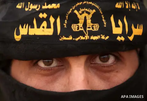 Members of Al-Quds Brigades, the military wing of Palestinian Islamic Jihad, demonstrate their skills during military training exercises, in Deir al-Balah in the central Gaza Strip, November 25, 2014. Photo by Ashraf Amr...