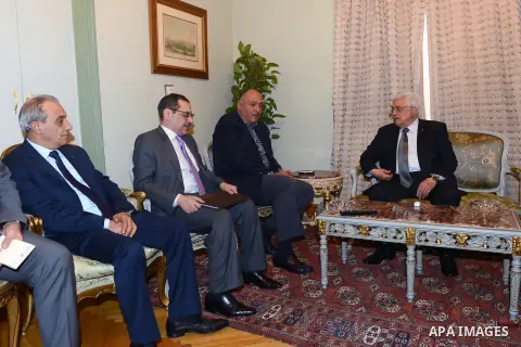 Palestinian President Mahmoud Abbas (R), meets with Egyptian foreign minister Sameh Shukri, in Cairo on November 28, 2014. Photo by Thaer Ganaim