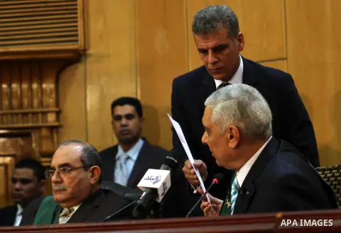 An Egyptian Judge Mahmoud Kamel Rashedy, attends the trial of Egypt's former president Hosni at the court in Cairo, Egypt, Nov. 29, 2014 after a court dismissed a murder charge against the ousted leader over the deaths o...