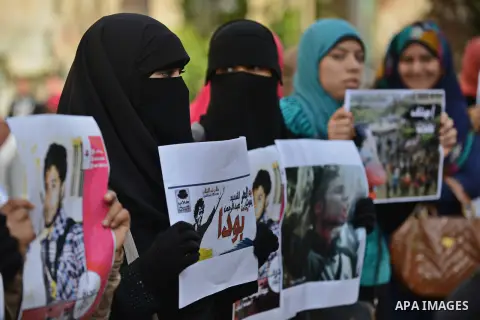 Egyptian students who support Muslim Brotherhood and ousted president Mohammed Morsi, take part in a demonstration to demand for release the detained students, at Cairo University, in Cairo, Dec. 02, 2014. Photo by Amr S...