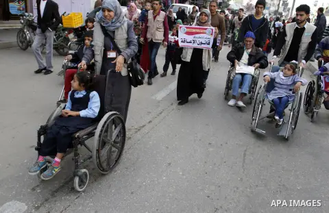 Palestinian disabilities participate in the race wheelchairs, during a rally marking the International Day of Persons with Disabilities in Rafah in the southern in Gaza strip on Dec. 03, 2014. Photo by Abed Rahim Khatib