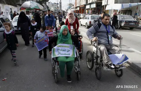 Palestinian disabilities participate in the race wheelchairs, during a rally marking the International Day of Persons with Disabilities in Rafah in the southern in Gaza strip on Dec. 03, 2014. Photo by Abed Rahim Khatib