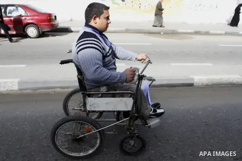 Palestinian disabilities participate in the race wheelchairs, during a rally marking the International Day of Persons with Disabilities in Rafah in the southern in Gaza strip on Dec. 03, 2014. Photo by Abed Rahim Khatib