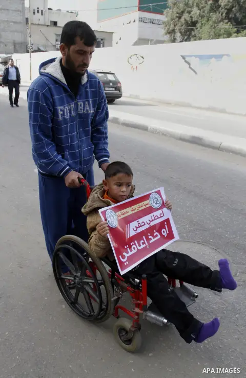 A Palestinian Disability participates in the race wheelchairs, during a rally marking the International Day of Persons with Disabilities in Rafah in the southern in Gaza strip on Dec. 03, 2014. Photo by Abed Rahim Khatib