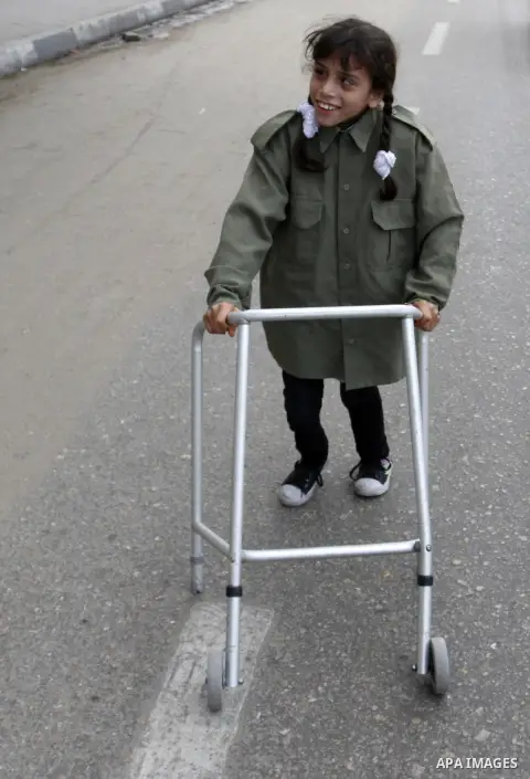 A Palestinian Disability participates in the race wheelchairs, during a rally marking the International Day of Persons with Disabilities in Rafah in the southern in Gaza strip on Dec. 03, 2014. Photo by Abed Rahim Khatib