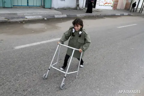 A Palestinian Disability participates in the race wheelchairs, during a rally marking the International Day of Persons with Disabilities in Rafah in the southern in Gaza strip on Dec. 03, 2014. Photo by Abed Rahim Khatib