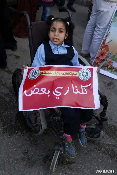 A Palestinian Disability participates in the race wheelchairs, during a rally marking the International Day of Persons with Disabilities in Rafah in the southern in Gaza strip on Dec. 03, 2014. Photo by Abed Rahim Khatib