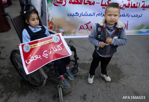 Palestinian disabilities participate in the race wheelchairs, during a rally marking the International Day of Persons with Disabilities in Rafah in the southern in Gaza strip on Dec. 03, 2014. Photo by Abed Rahim Khatib