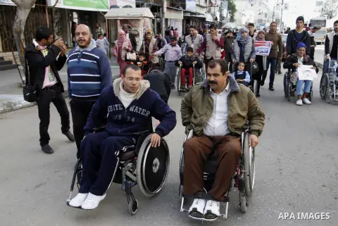 Palestinian disabilities participate in the race wheelchairs, during a rally marking the International Day of Persons with Disabilities in Rafah in the southern in Gaza strip on Dec. 03, 2014. Photo by Abed Rahim Khatib
