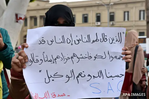 Egyptian students who are members in Students Against the Coup group (SAC), take part in a demonstration against the Cairo Criminal Court's decision to drop charges against former president Hosni Mubarak, at Cairo Univer...