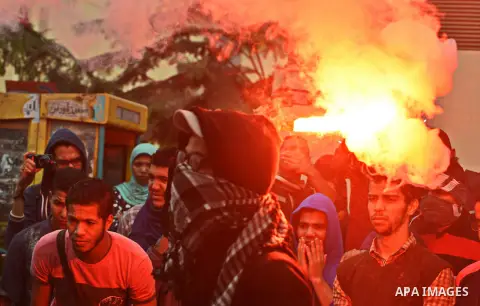 Egyptian students who are members in Students Against the Coup group (SAC), take part in a demonstration against the Cairo Criminal Court's decision to drop charges against former president Hosni Mubarak, at Cairo Univer...